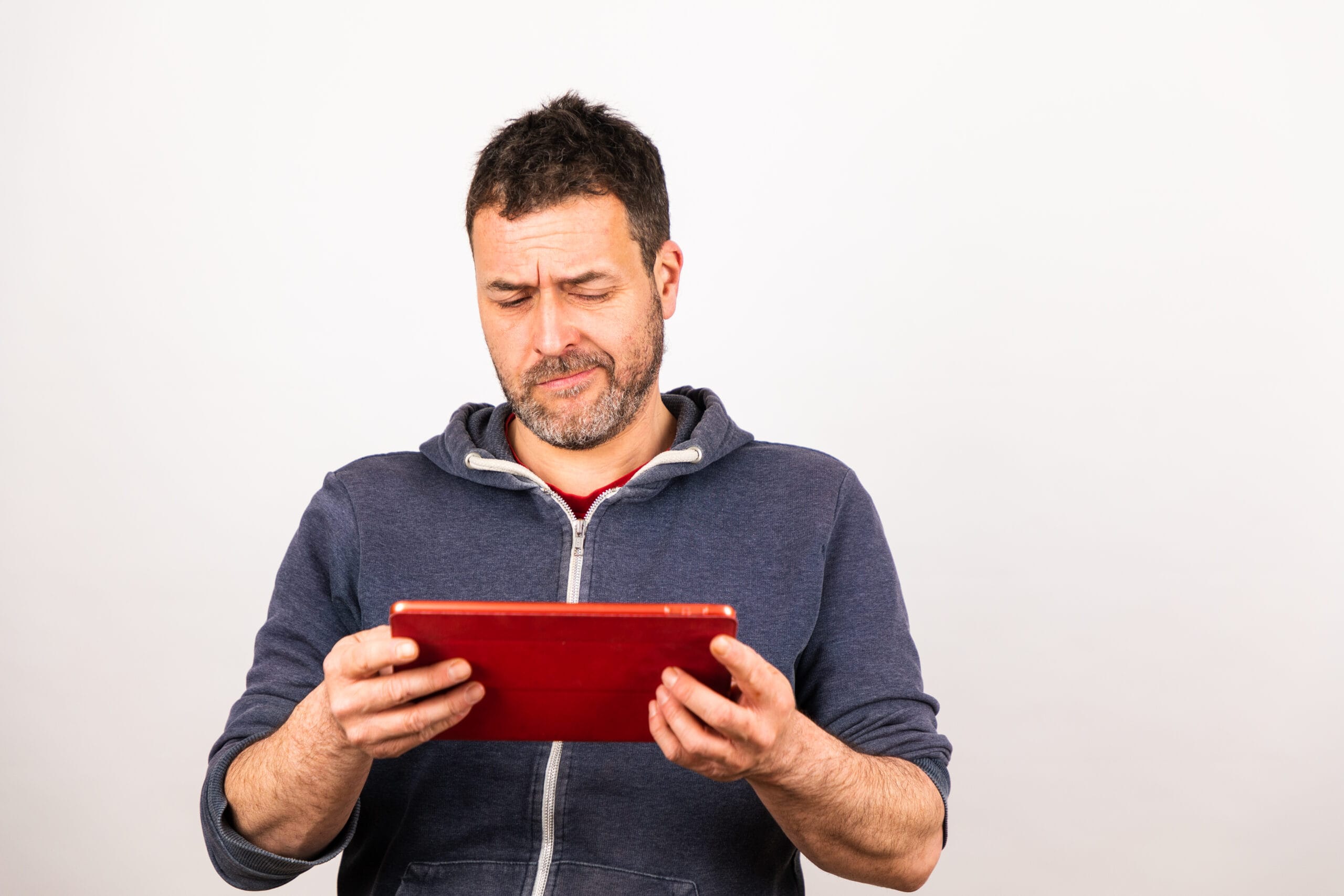 young man uses a tablet with white background